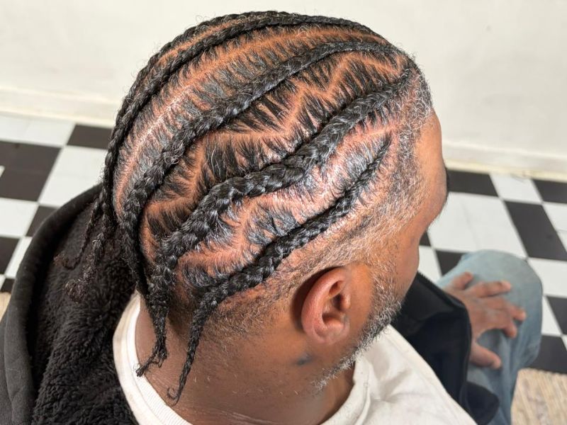The Art of Wavy Cornrows: Elegance, Character, and Protective Styling for Men